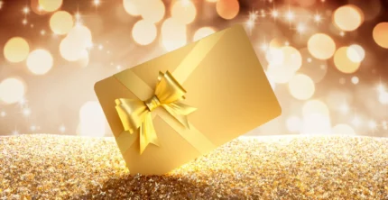 gold gift card with bow on glitter