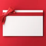 White gift card with red ribbon and bow